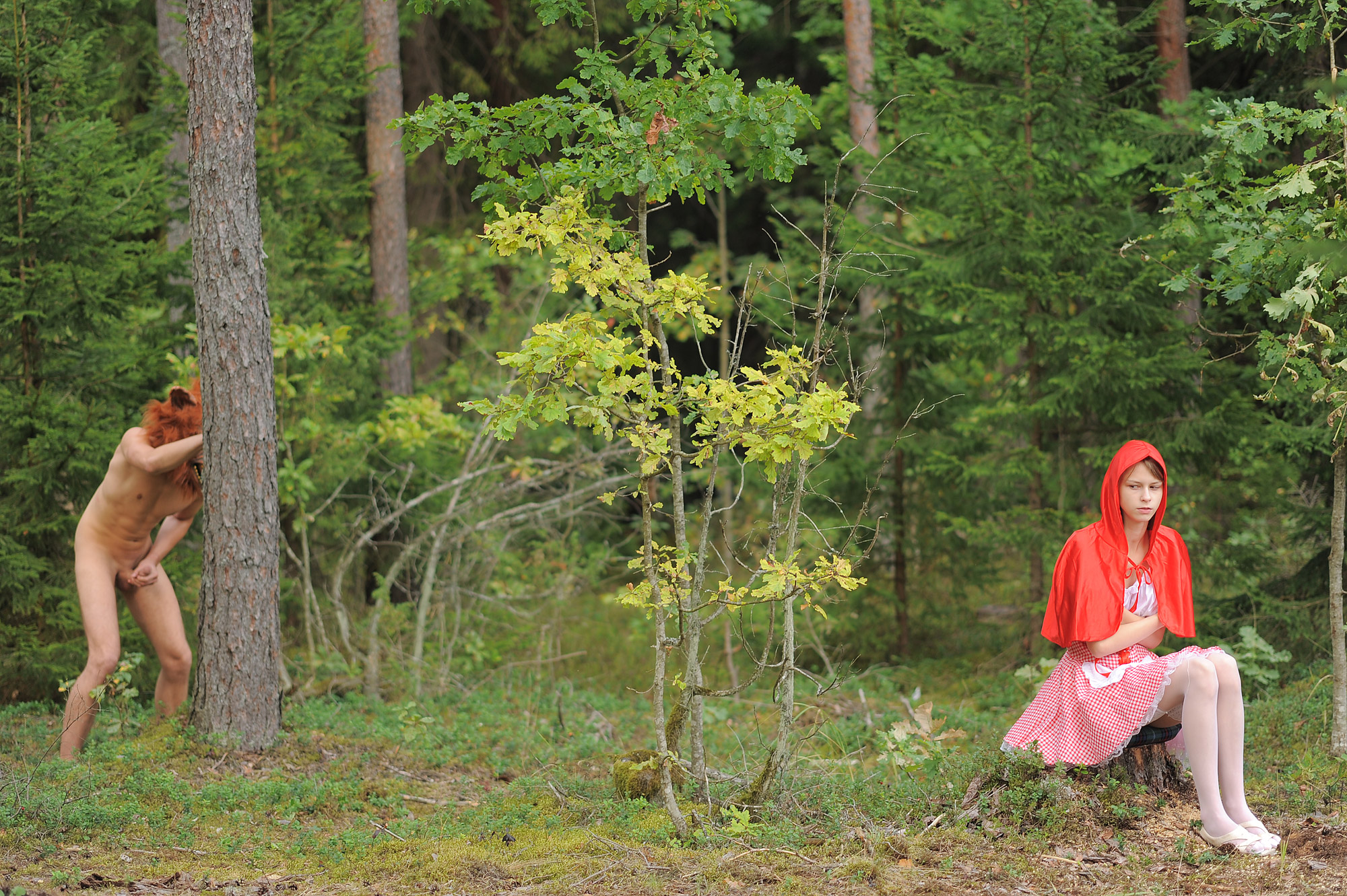 Pure and naked little red riding hood lost in the woods